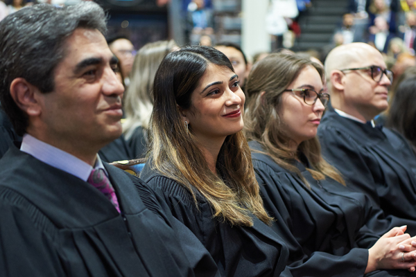 CCNM offers naturopathic medicine bridge delivery for international medical graduates Students smiling at their convocation ceremony